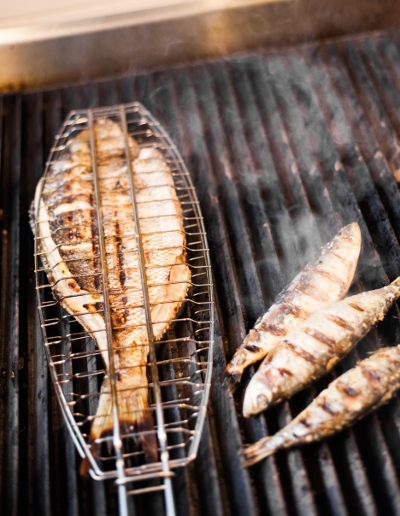 Barbecue sea bass on the frill in a fish basket