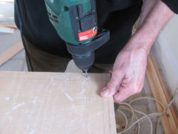 Drilling Holes Following The Barbeque Smoker plans For The Rear Panel