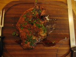 Butterflied shoulder of grilled bbq lamb