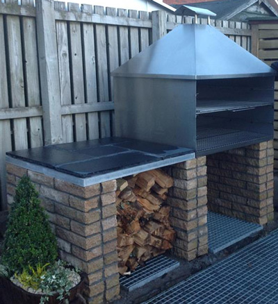 Here's one of our stainless steel charcoal grills with hood and flue