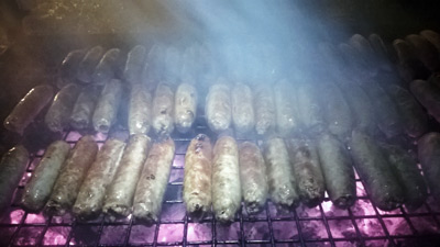 Charcoal grilling polish sausage