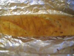 Serve you barbecue Camembert with slices of garlic bread