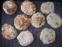 Trout fish cakes cooking on the grill