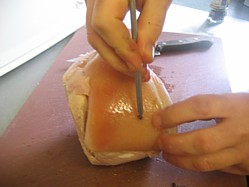 Graphic Inserting Cloves Into Ham Using A Skewer