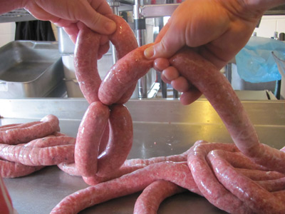 Nip the sausage again to create the next three sausage links