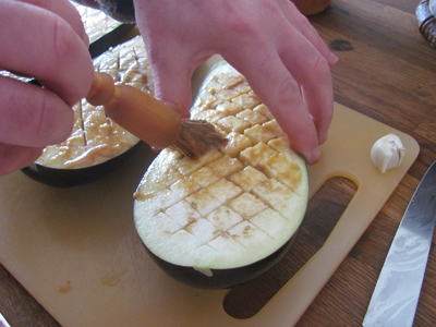 Add the miso paste through diagonal scoring of the aubergine