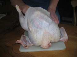Rubbing the breast of a smoked turkey