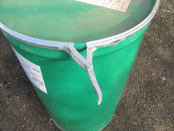 The Barrel Smoker Lid Is Secured By A Metal Banding Clasp