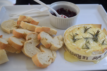 Baked Camembert With Cranberry Sauce And Sliced Baguette