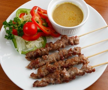 Barbecue beef satay skewers with salad