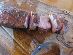 Slicing the grilled barbecue pork tenderloin