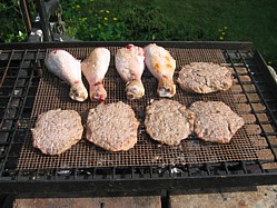 Grilling some Burger and chicken legs