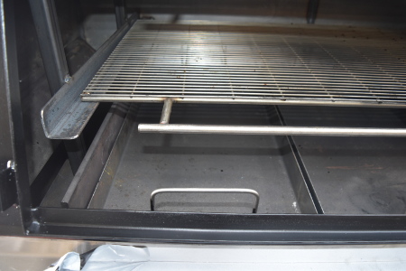 The charcoal trays allow direct heat and also act as the baffle plates when smoking