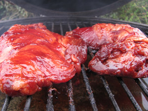 Chinese Barbecue Pork Marinaded And Freshly Slapped On The Grill