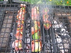 Grilling Avocado and bacon parcels in a basket