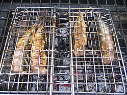 Sardines in a barbecue basket