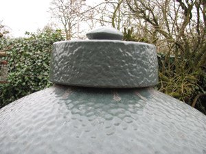 The ceramic snuffer cap on the Big Green Egg