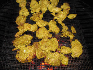 Grilling the marinated chicken