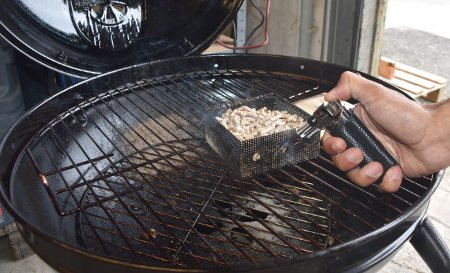 Lighting the Grillson cold smoke generator with the flame torch which is included in the kit