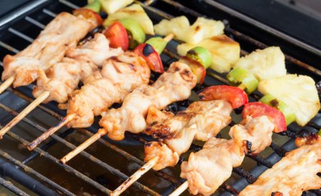 Indian BBQ chicken kebabs on the grill