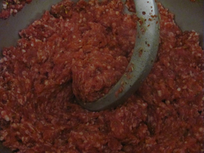 Mixing sausage meat with an electric food mixer