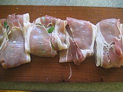 Plank cooked pheasant breast wrapped in bacon